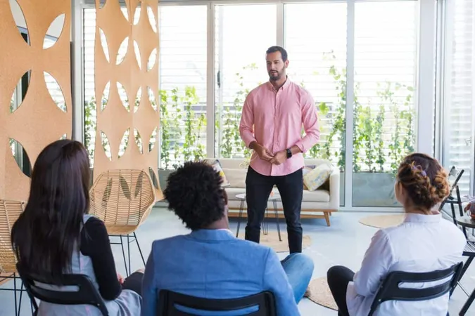 Serious Confident Male Coach Holding Seminar X - Associate Certified Coach study guide