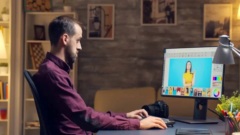 Creative Photographer Using Digital Retouching Program Late Night Retouching Camera Office X - Adobe Certified Expert in Photoshop study guide