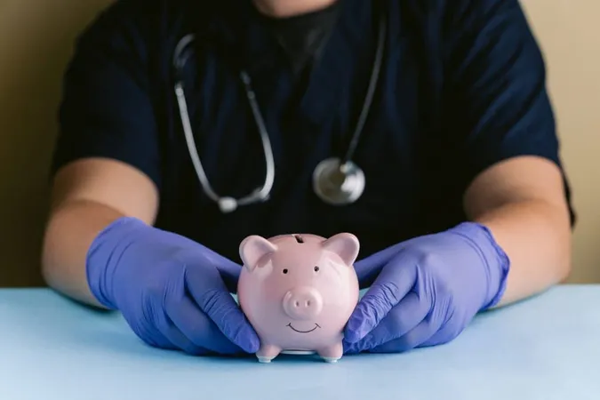 Medical Professional With Gloved Hands Holding Pink Piggy Bank X - Affordable Care Act Certified study guide