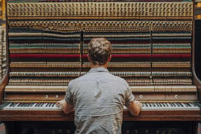 Man Playing Piano With Exposed Internal Mechanisms X - American Guild of Organists Certification study guide
