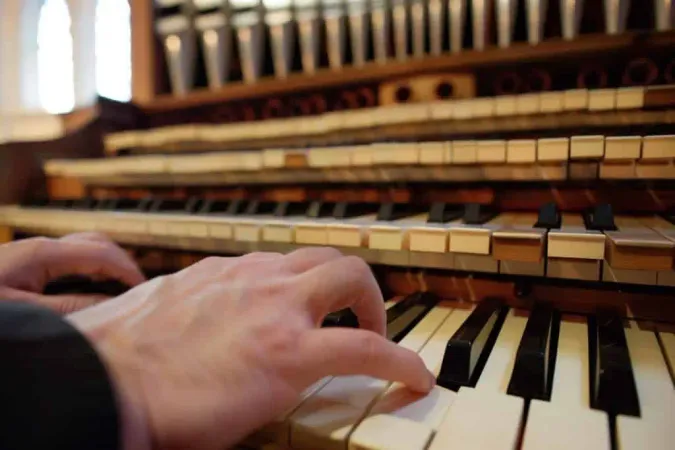 Organists Hands Playing Keys Large Pipe Organ X - American Guild of Organists Certification study guide