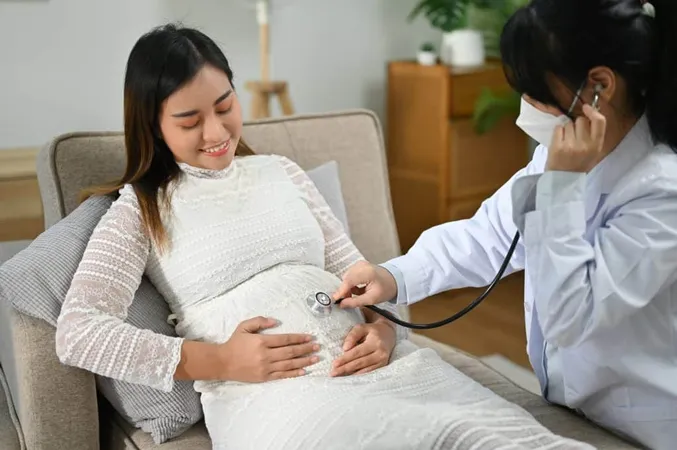 Female Doctor Obstetrician Listening Baby S Heartbeat Lungs Sound By Stethoscope X - American Board of Obstetrics & Gynecology study guide