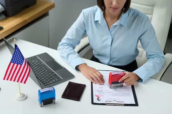 High Angle View Professional Specialist Rejecting Visa Tourist Putting Stamp Document X - American Payroll Association Certification study guide