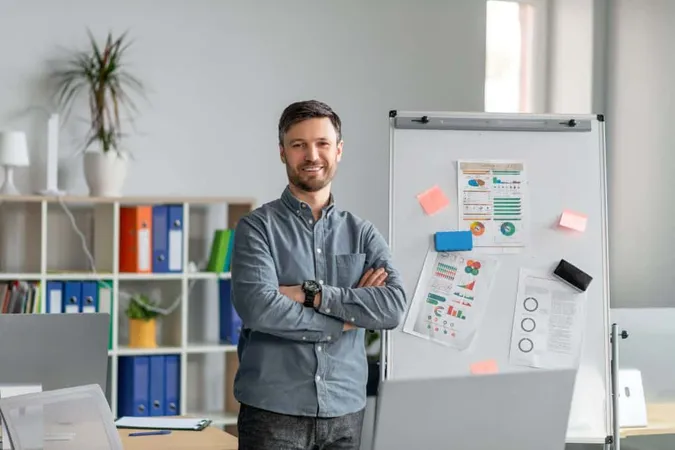 Confident Mature Businessman Making Project Presentation Demonstrating Graphs Whiteboard X - Agile Product Management Certification study guide