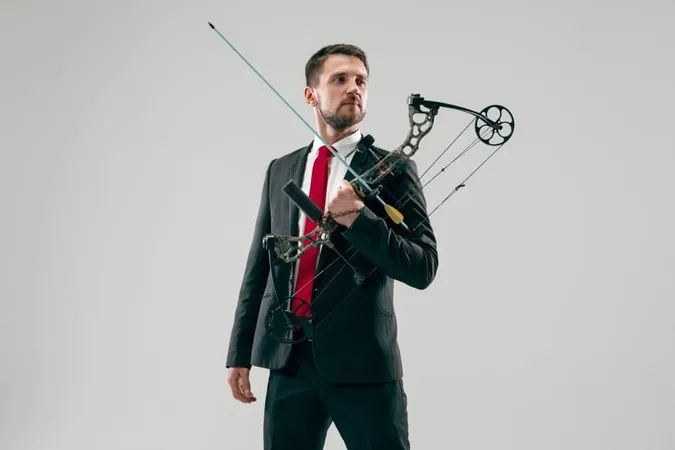 Businessman Aiming Target With Bow Arrow Isolated Gray Studio Background Business Goal Challenge Competition Achievement Purpose Victory Win Clarity Winner Success Concept X - Archery Trade Association Bow Technician Certification study guide