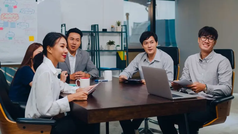 Millennial Asia Businessmen Businesswomen Having Conference Video Call Meeting Brainstorming Ideas About New Project Colleagues Working Together Planning Strategy Enjoy Teamwork Modern Office X - Association for Talent Development Master Trainer Certification study guide