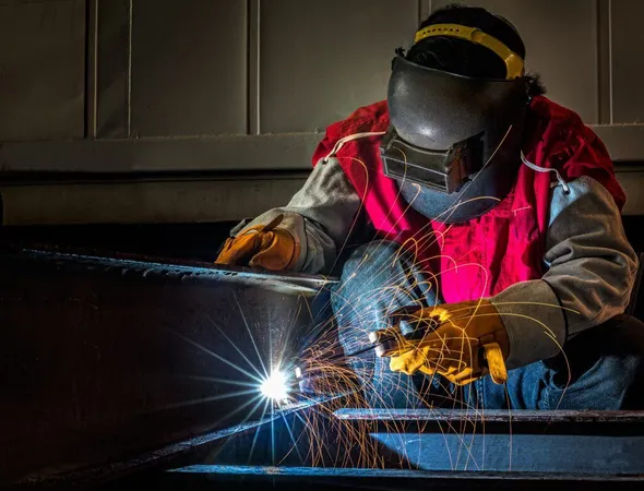 Worker Works Hard With Welding Process X - AWS Certified Welder study guide