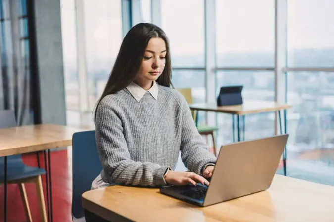 Cute Business Woman Sitting Desk - AZ-900 study guide