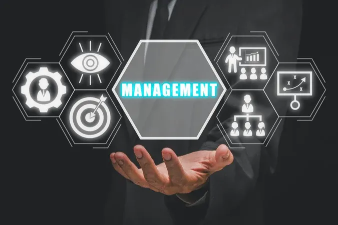 Management Concept Businessman Hand Holding Management Icon Virtual Screen X - Business Continuity Management Certification study guide