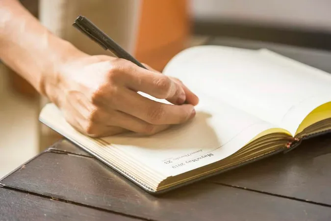 Close Up Woman Writing Statistic - Blog study guide