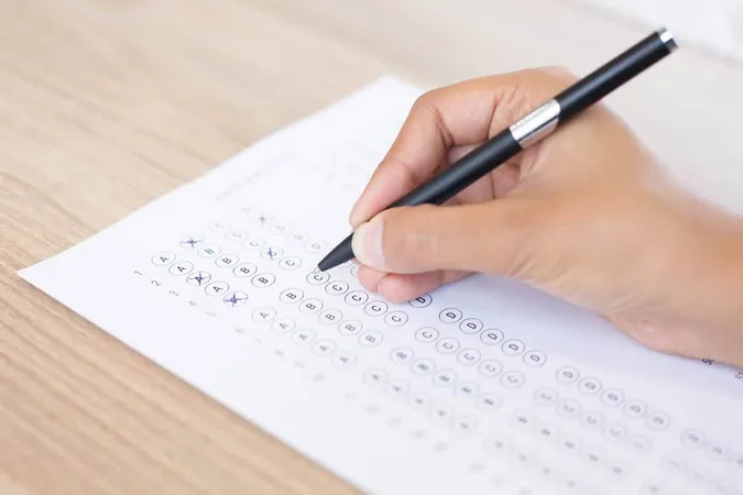 Closeup Person Filling Out Quest - Blog study guide