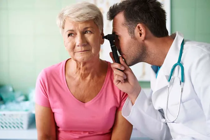 Doctor Examining Ear Senior Woma - Blog study guide