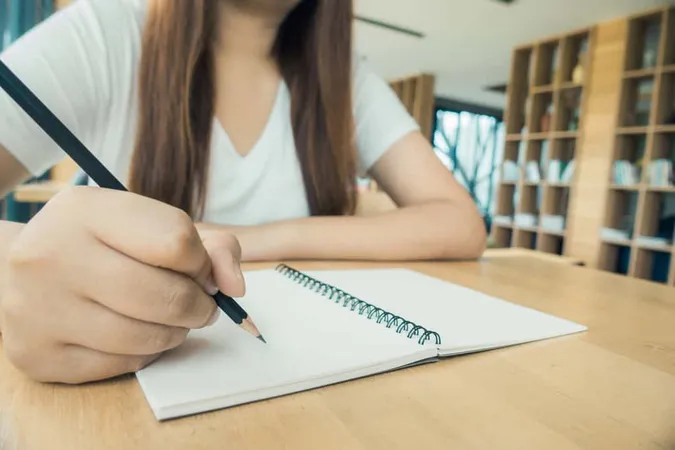 Female Student Taking Notes From 1 - Blog study guide