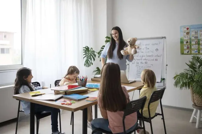 Full Shot Smiley Teacher Holding - Blog study guide