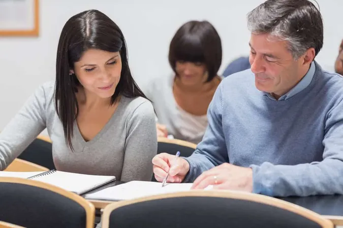 Man Showing Woman Something Note - Blog study guide