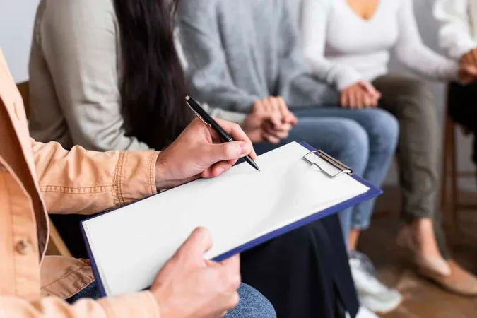 Man Writing Clipboard Group Ther - Blog study guide