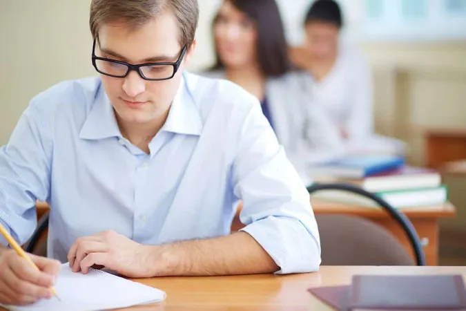 Student With Glasses Writing 1 1 - Blog study guide
