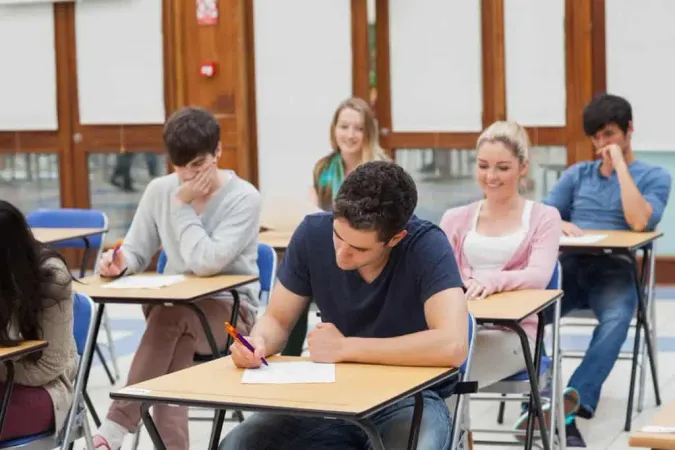 Students Sitting Exam Room Writi - Blog study guide