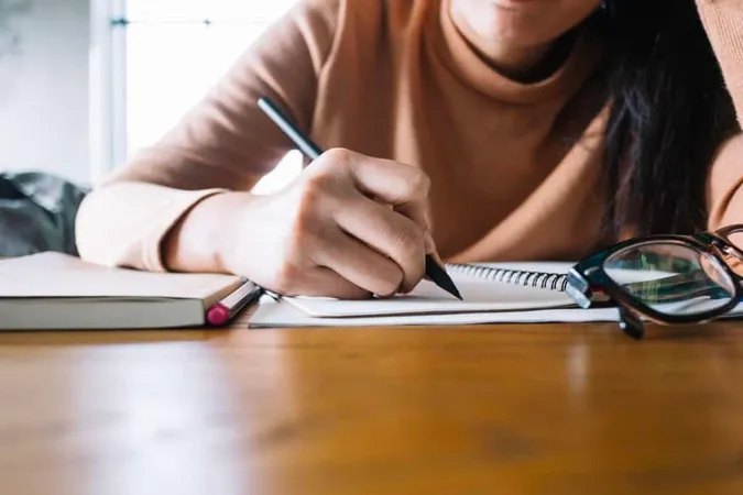 Girl Writing Notebook 1 1 - Blog study guide