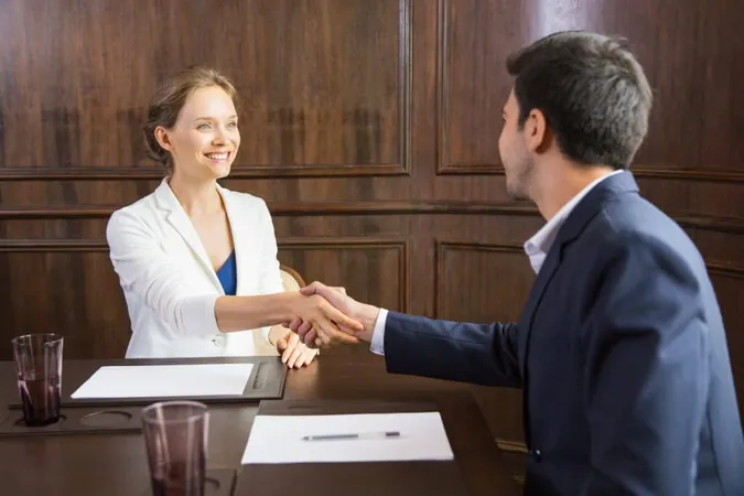 Business Woman Shaking Hands With Man X - Certified Acceptance Agent study guide