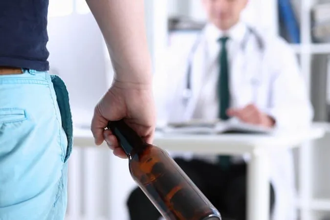 Alcoholic Hold Hand Empty Bottle Doctor Reception - California Association for Alcohol/Drug Educators Certification study guide