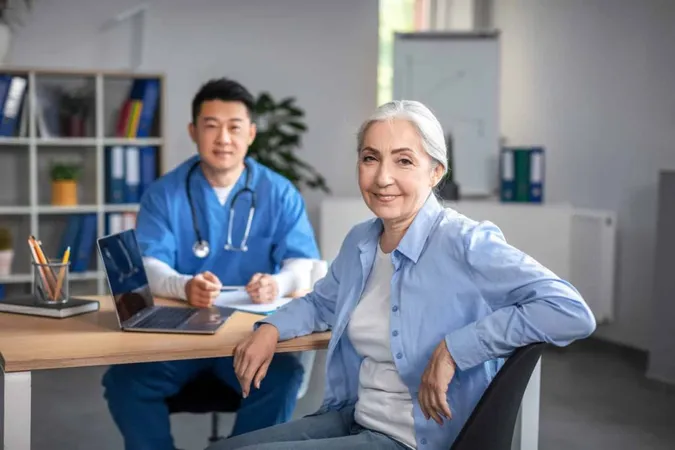 Smiling Elderly European Woman Patient Meeting With Young Asian Doctor Uniform Look Camera 1 X - Certified Aging-in-Place Specialist study guide
