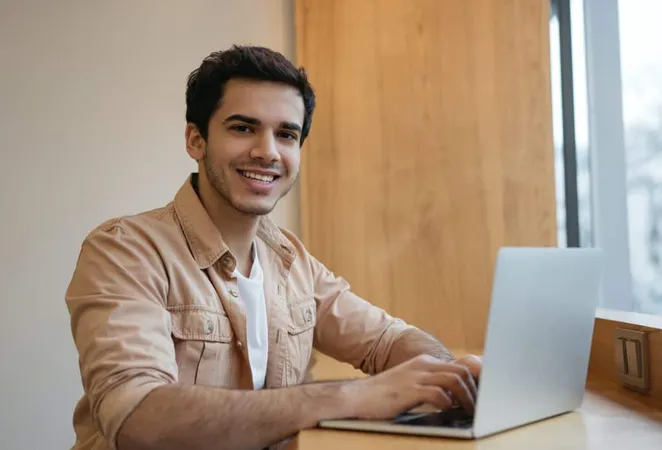 Handsome Indian Programmer Using Laptop Computer Working From Home X - Certified Application Security Engineer study guide