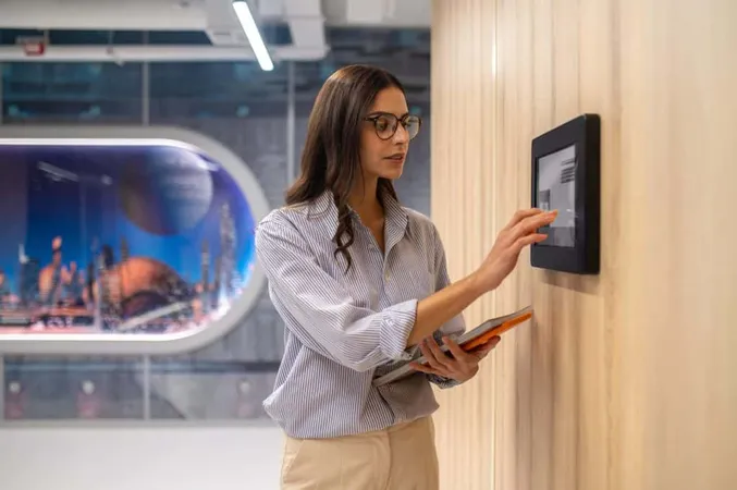 Woman Touching Control Panel Wall Corridor X - Certified Alarm Technician Level I study guide