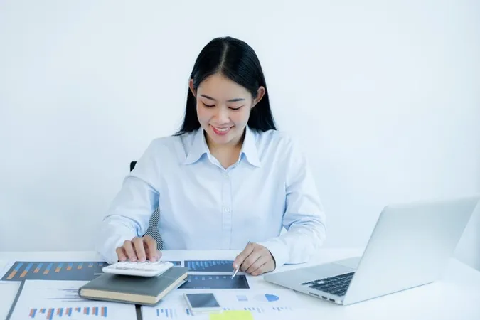 Businesswoman Analysis Chart With Laptop Home Office Setting Challenging Business Goals X - Certified Budget Analyst study guide