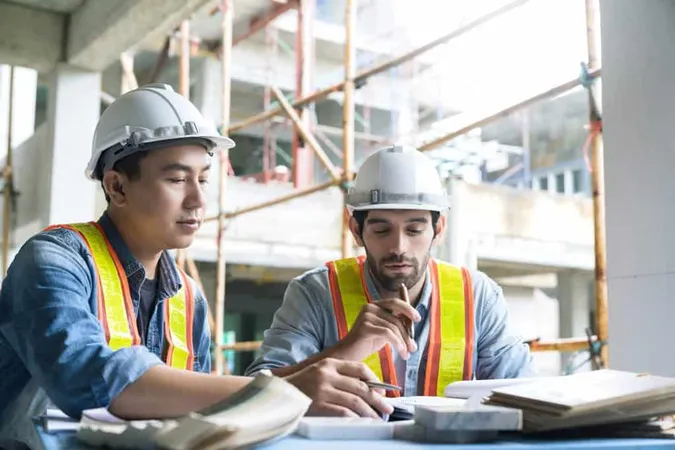 Young Asian Engineers Caucasian Engineer Colleagues Site Inspector Discuss Together Using Notebook Computer Paper Blueprint Building Construction Sitehome Renovation Ideas Concept 1 X - Certified Construction Auditor study guide