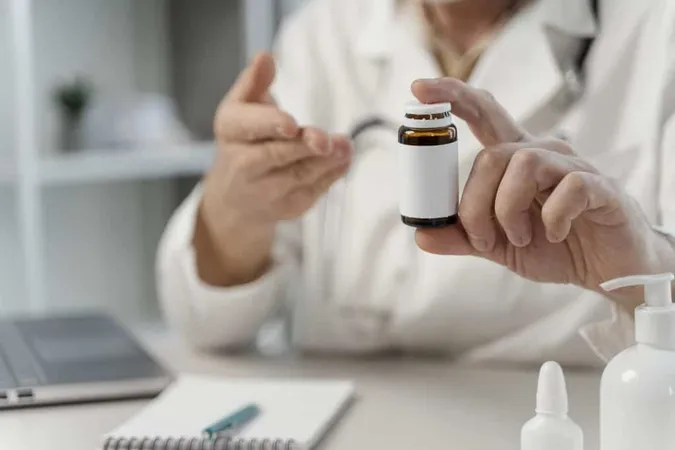 Male Doctor Prescribing Pills Patient X - Certified Classical Homeopath study guide