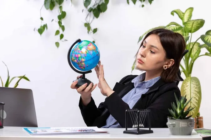 Front View Beautiful Young Businesswoman Black Jacket Blue Shirt Observing Little Globe Front Table Business Job Office X - Certified Climate Change Professional study guide