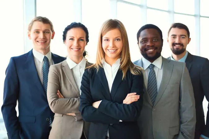 Young Businesswoman With Co Workers X - Certified Diversity Executive study guide