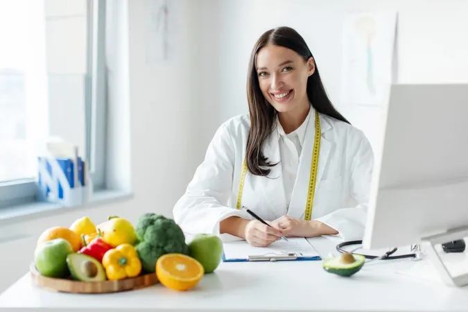 Portrait Cheerful Female Dietologist Writing Healthy Eating Plan Weight Loss Diet Patient 1 X - Certified Dietician Nutritionist study guide