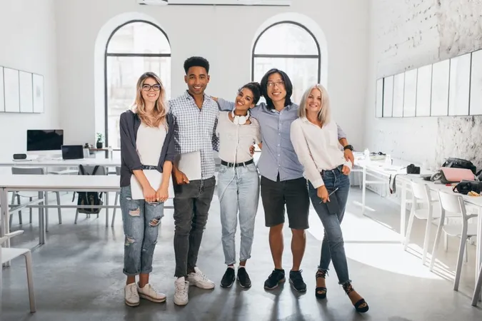 Full Length Portrait Shy Blonde Woman White Sneakers Holding Laptop After Seminar Stands Beside African Friend Excited International Students Posing Together After Lecture Spacious Hall X - Certified Diversity Professional study guide