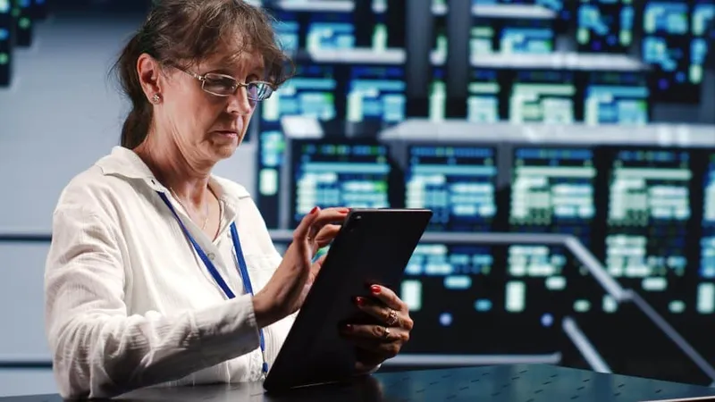 Mechanic With Tablet Fixing Servers X - Certified Data Steward study guide