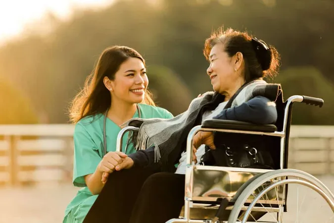 Asian Senior Woman Sitting Wheelchair With Woman Doctor Uniform Park Hospital X - Certified Disability Specialist study guide