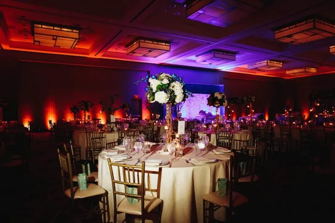 Decorated Banquet Hall With Served Round Table With Hydrangea Centerpiece Chiavari Chairs X - Certified Event Designer study guide