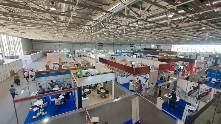 People Visiting Trade Show With Many Stands Booths - Certified in Exhibition Management study guide