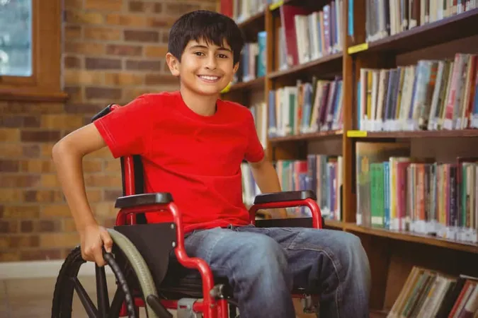 Portrait Boy Sitting Wheelchair Library X - Certified Adapted Physical Educator study guide
