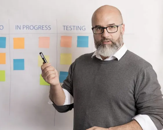 Portrait Man Presenting Business Plan X - Certified Agile Essentials Specialist study guide