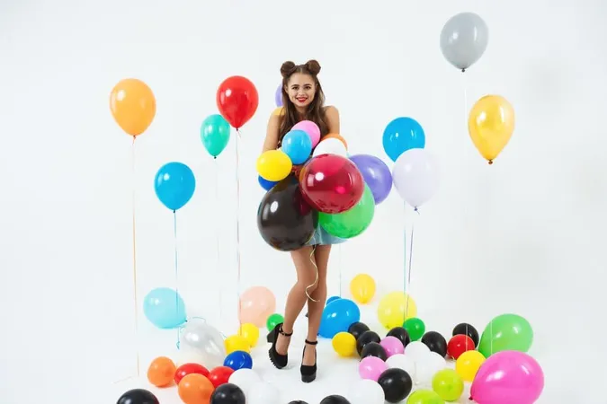 Stylish Female Hipster Posing With Big Balloons White X - Certified Balloon Artist study guide