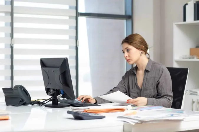 Front View Young Beautiful Lady Grey Shirt Working Her Pc Looking Through Documents Sitting Inside Her Office Daytime Building Job Activity X - Certified Bookkeeper study guide
