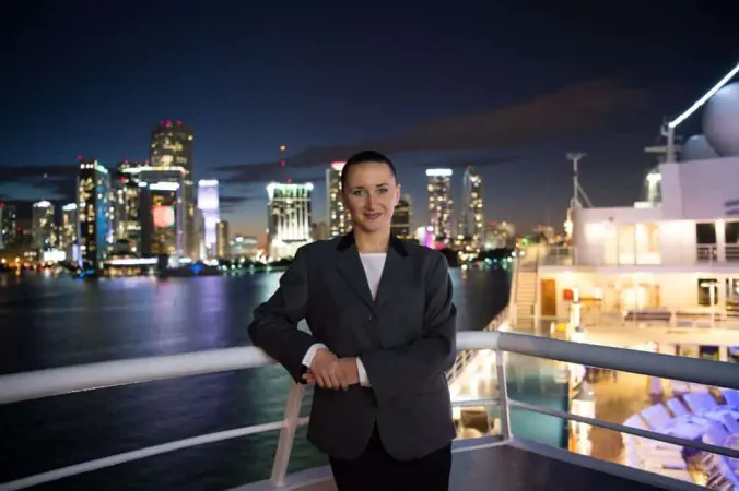 Woman Smile Grey Jacket Balcony Skyline Night View With Light Illumination Miami Usa Summer Vacation Nightlife Lifestyle Concept X - Certified Cruise Counselor study guide