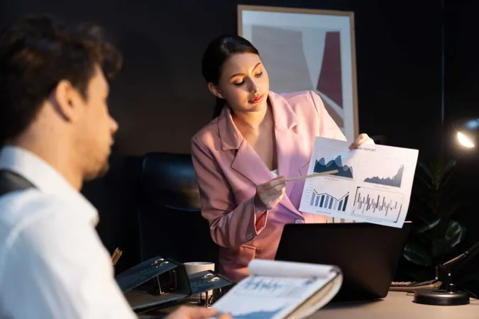 Focusing Woman Presenting Graph While Man Holding Paper Sign Postulate X - Certified Valuation Analyst study guide
