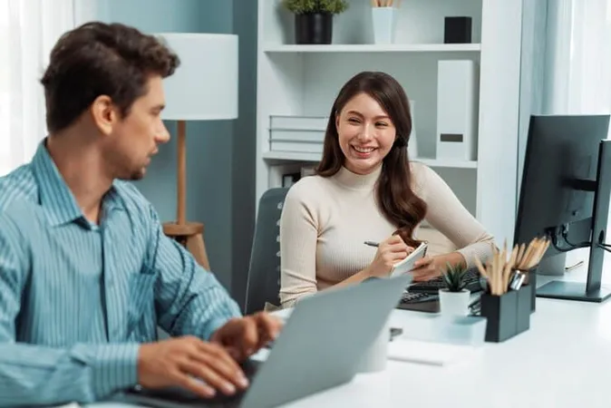 Smart Manager Talking Woman Coworker While Typing Laptop Postulate - Certified Employment Support Professional study guide