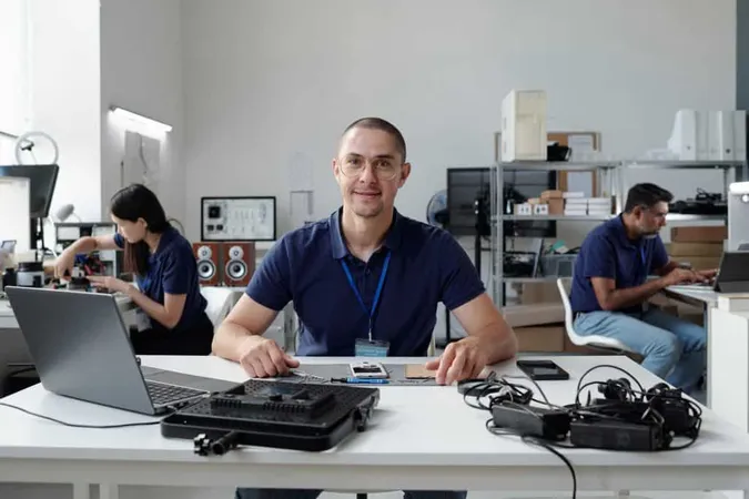 Portrait Man Wearing Badge Tech Office Setting X - Certified Electronics Technician study guide