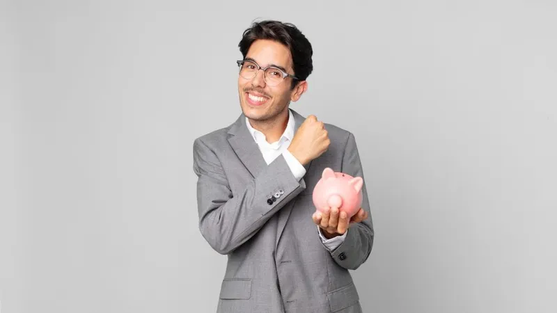 Young Hispanic Man Feeling Happy Facing Challenge Celebrating Holding Piggy Bank X - Certified Fund Specialist study guide