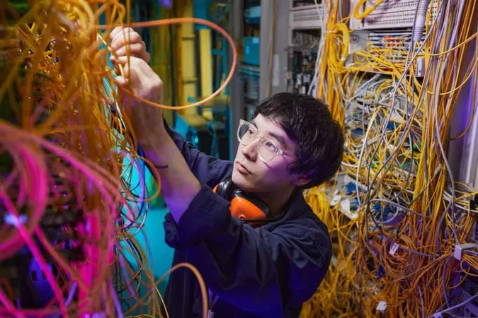 High Angle Portrait Young Network Technician Connecting Cables Server Room Copy Space X - Certified Interconnect Designer study guide