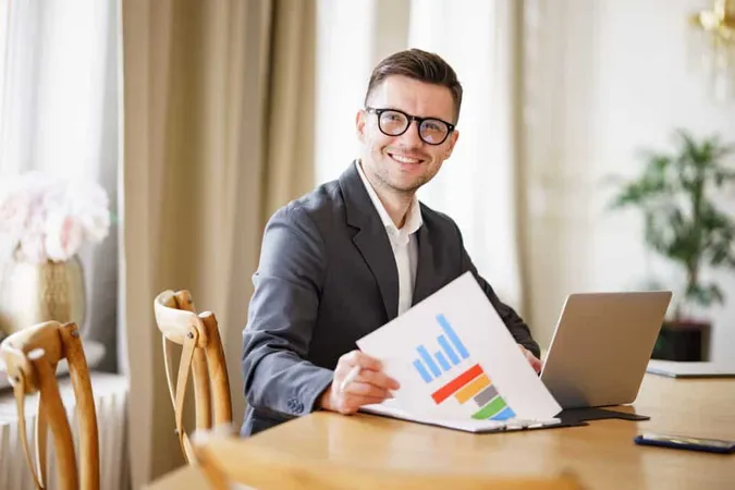 Congenial Businessman Reviews Colorful Graphs His Radiant Smile Chic Glasses Denoting X - Chartered Investment Manager study guide